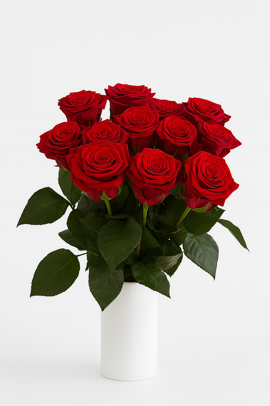 Bouquet of red roses in a white vase on a light gray background