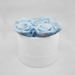 Load image into Gallery viewer, Light blue roses in a white box
